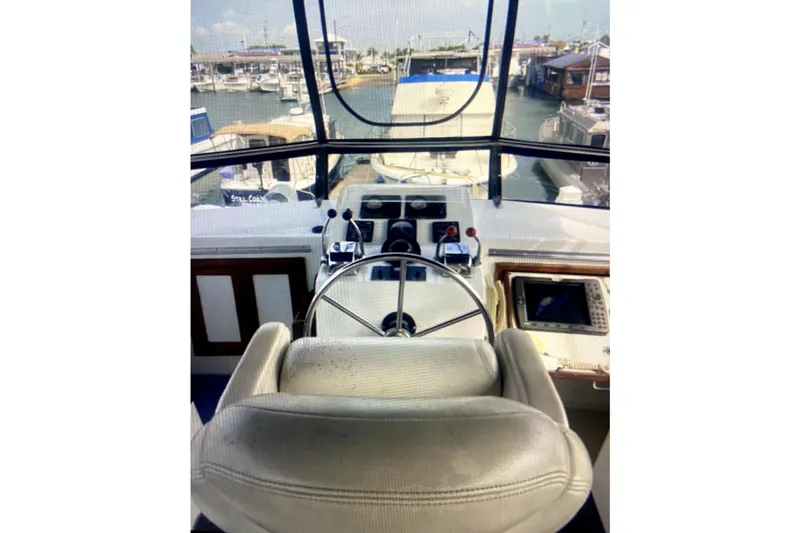 Slide: The Image of 1987 Senator-Chien Hwa Futura Sundeck yacht helm with marina view. - 5
