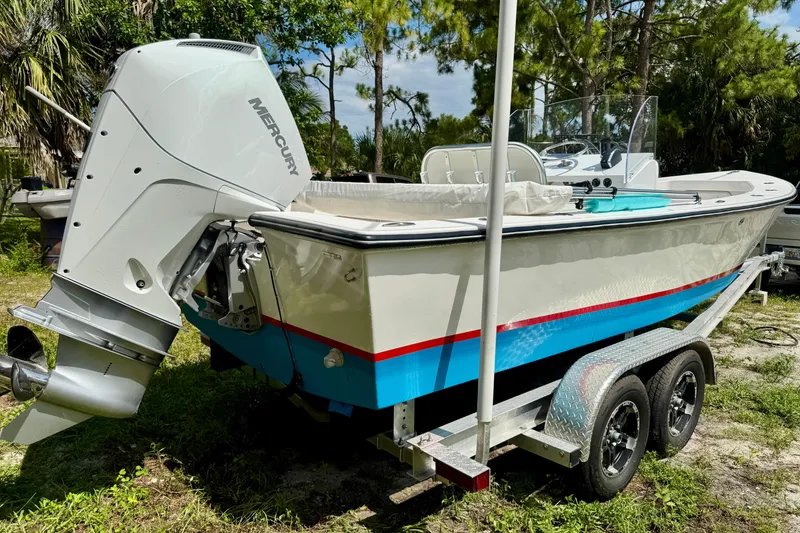 Slide: The Image of 2025 Rambo 22 Center Console boat on trailer with Mercury outboard motor. - 15