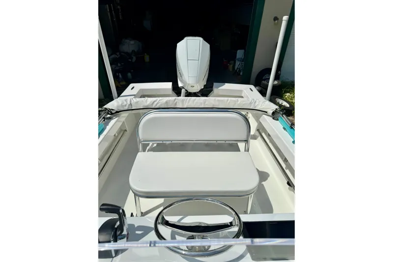 Slide: The Image of 2025 Rambo 22 Center Console boat interior with steering wheel and seating. - 2