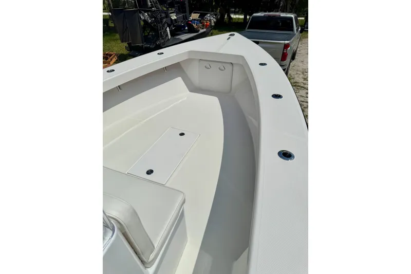 Slide: The Image of 2025 Rambo 22 Center Console boat interior with sleek white design and spacious seating. - 5