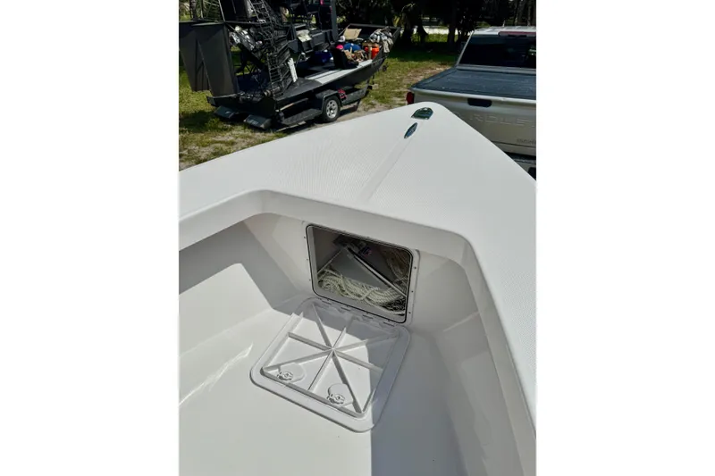 Slide: The Image of 2025 Rambo 22 Center Console boat with open storage compartment on deck. - 6