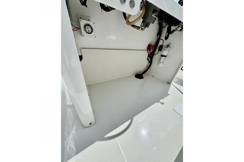 Slide: The Image of Interior view of 2025 Rambo 22 Center Console boat, showcasing wiring and equipment. - 8