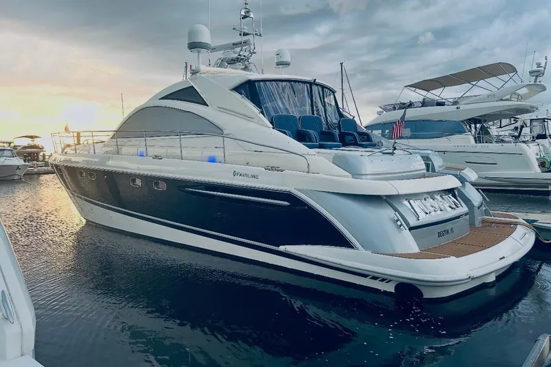 The Image of 2009 Fairline Targa 52 yacht docked at sunset, showcasing sleek design and luxury features. - 0