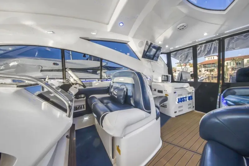 Slide: The Image of Luxurious interior of 2009 Fairline Targa 52 yacht with modern seating and navigation equipment. - 11