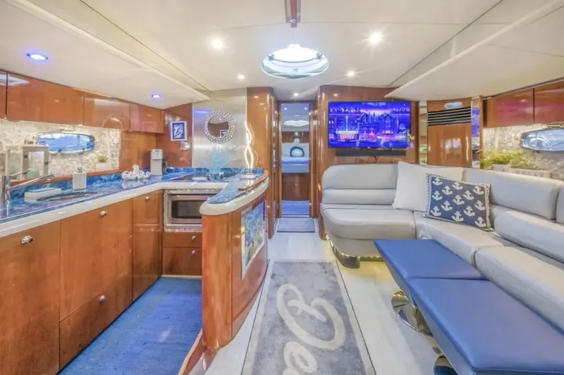 Slide: The Image of Luxurious interior of 2009 Fairline Targa 52 yacht with modern kitchen and cozy seating area. - 15
