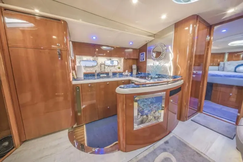 Slide: The Image of Luxurious interior of a 2009 Fairline Targa 52 yacht with elegant wood finishes. - 16