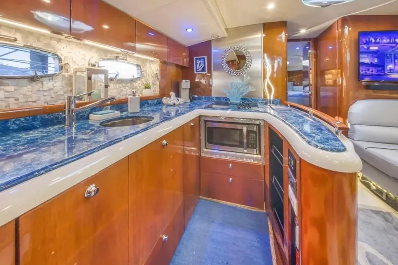 Slide: The Image of Luxurious 2009 Fairline Targa 52 yacht interior with modern kitchen and elegant design. - 17