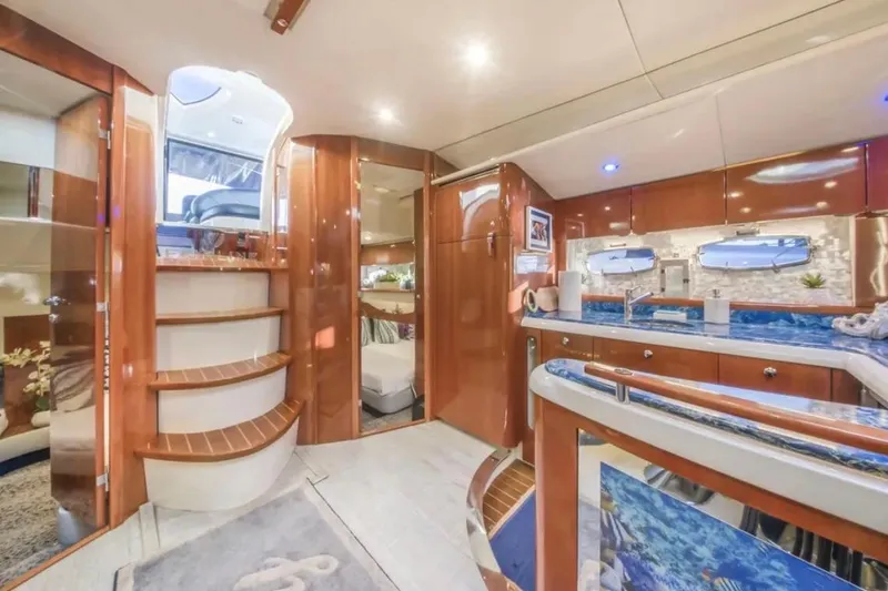 Slide: The Image of Luxurious interior of 2009 Fairline Targa 52 yacht with elegant wood finishes and modern amenities. - 18