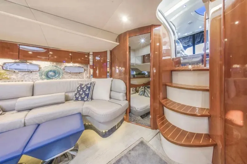 Slide: The Image of Luxurious interior of 2009 Fairline Targa 52 yacht with elegant seating and wooden staircase. - 19