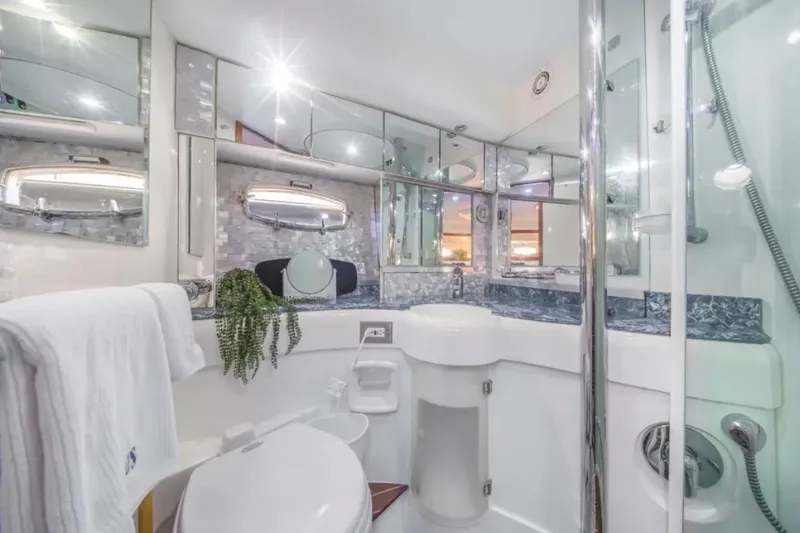 Slide: The Image of Luxurious bathroom in 2009 Fairline Targa 52 yacht, featuring elegant fixtures and mirrored accents. - 22