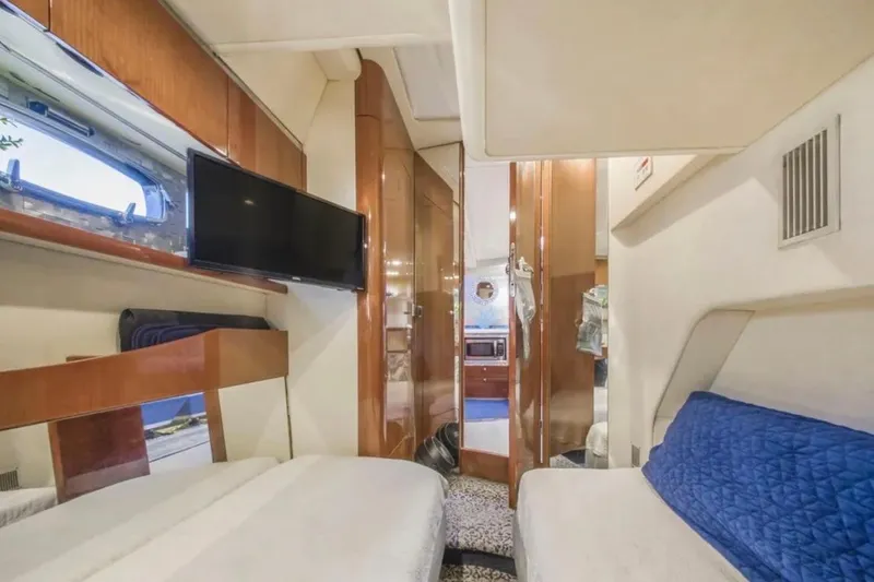 Slide: The Image of Luxurious interior of 2009 Fairline Targa 52 yacht with modern amenities and cozy seating. - 23