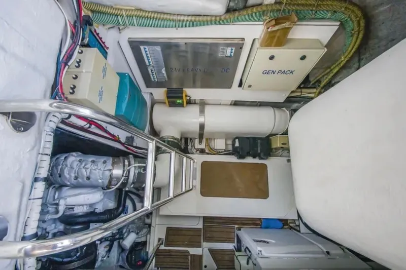 Slide: The Image of Engine room of 2009 Fairline Targa 52 yacht, featuring generator and electrical systems. - 25