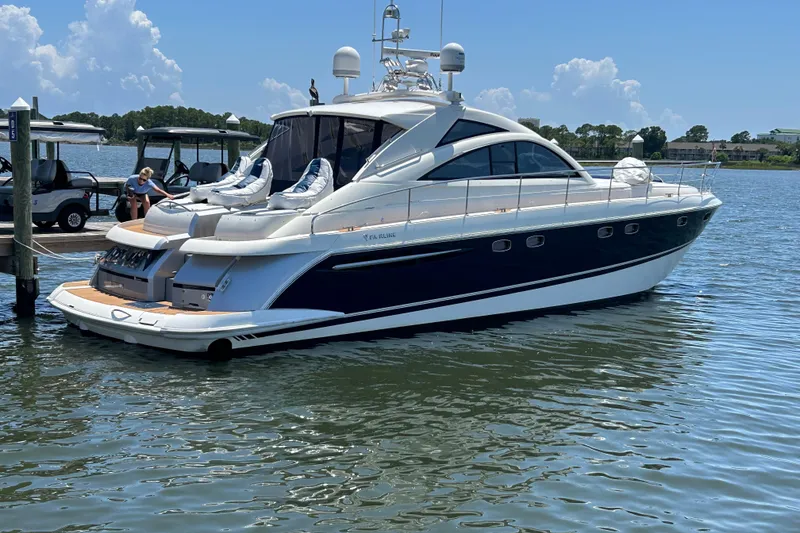 Slide: The Image of 2009 Fairline Targa 52 yacht docked on a sunny day, featuring sleek design and luxury amenities. - 3