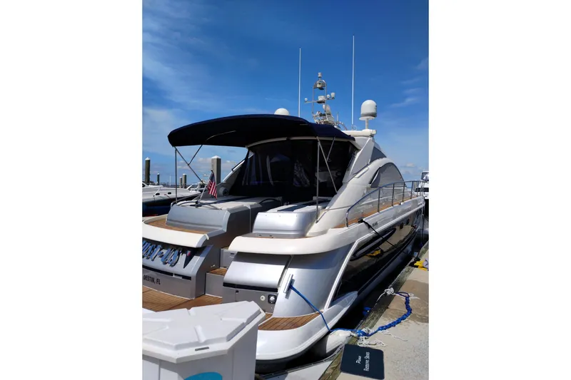 Slide: The Image of 2009 Fairline Targa 52 yacht docked under clear blue sky. - 4