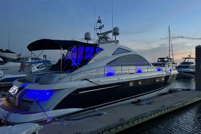 Slide: The Image of 2009 Fairline Targa 52 yacht docked at sunset with blue lights illuminating. - 7