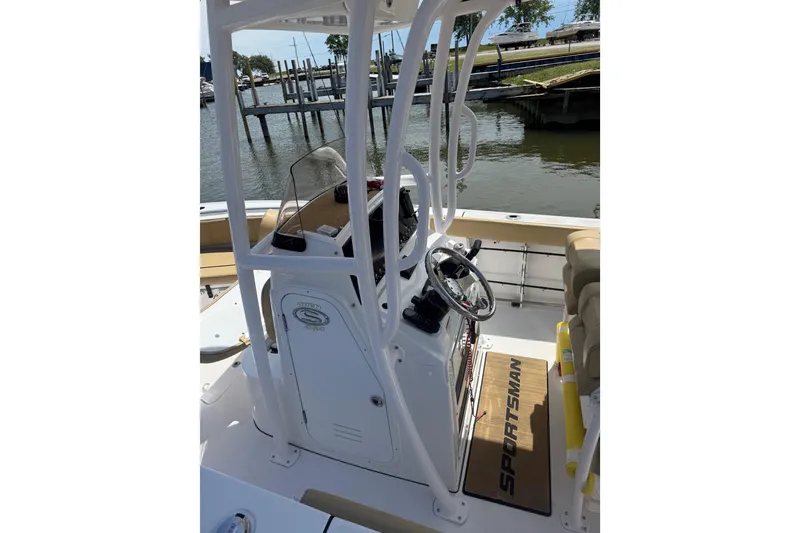 Slide: The Image of 2023 Sportsman Open 232 Center Console boat interior with steering wheel and seating. - 27