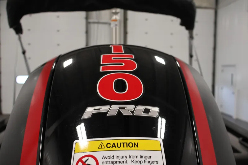 Slide: The Image of Close-up of 2026 Crestliner 1850 Super Hawk WT JS engine with '150 Pro' label. - 40