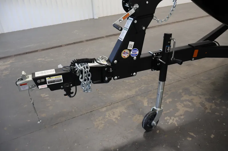 Slide: The Image of Trailer hitch of 2026 Crestliner 1850 Super Hawk WT JS with safety chains and wheel jack. - 42