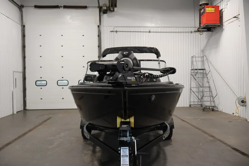 Slide: The Image of 2026 Crestliner 1850 Super Hawk WT JS boat in a garage setting. - 4