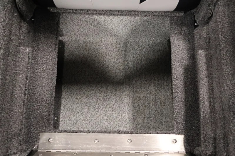 Slide: The Image of Carpeted storage compartment in 2026 Crestliner 1850 Super Hawk WT JS boat. - 33