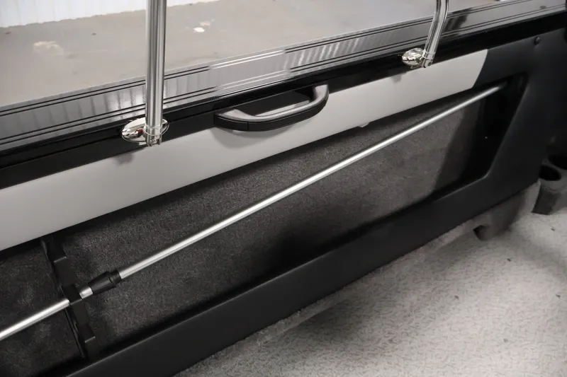 Slide: The Image of 2026 Crestliner 1850 Super Hawk WT JS interior detail with storage compartment and handle. - 37