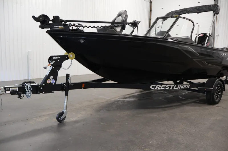 Slide: The Image of 2026 Crestliner 1850 Super Hawk WT JS boat on trailer in indoor setting. - 43