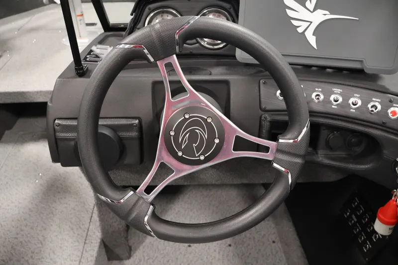 Slide: The Image of Steering wheel of 2026 Crestliner 1850 Super Hawk WT JS boat, featuring sleek design and controls. - 20