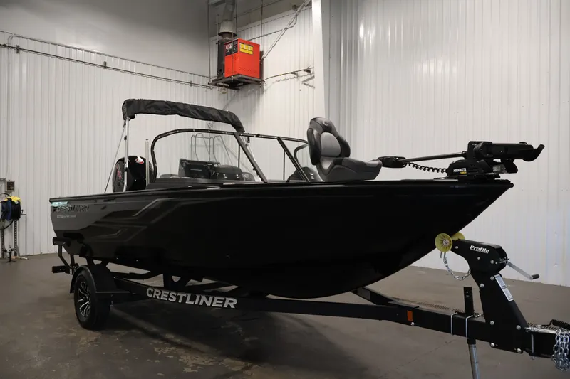 Slide: The Image of 2026 Crestliner 1850 Super Hawk WT JS boat in indoor showroom on trailer. - 5