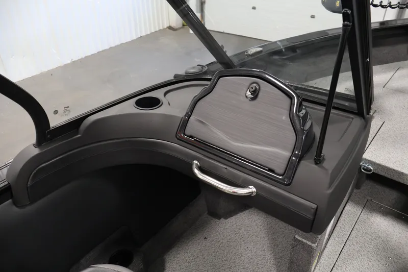 Slide: The Image of 2026 Crestliner 1850 Super Hawk WT JS boat interior with storage compartment and cup holder. - 28