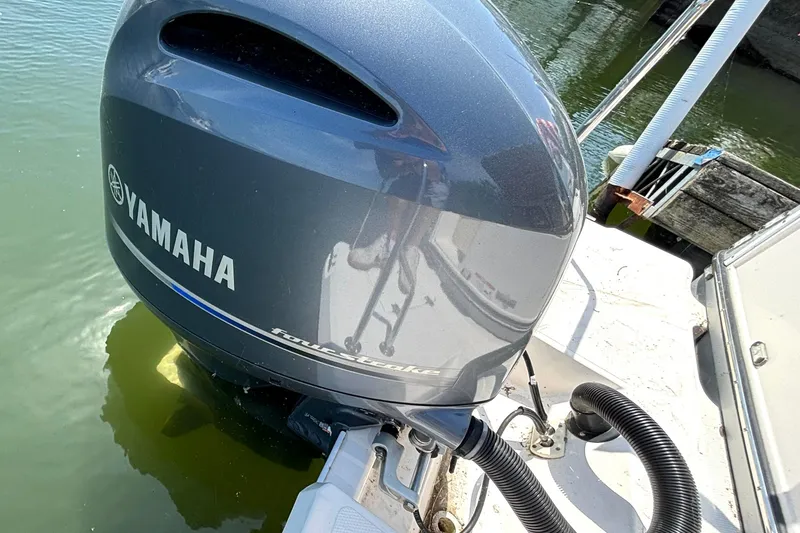 Slide: The Image of Yamaha outboard motor on 2021 Ranger Tugs R-25 boat, docked in water. - 19
