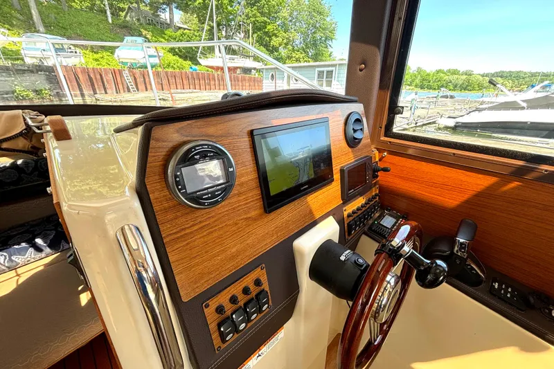 Slide: The Image of Interior helm of 2021 Ranger Tugs R-25 boat with modern navigation equipment. - 27