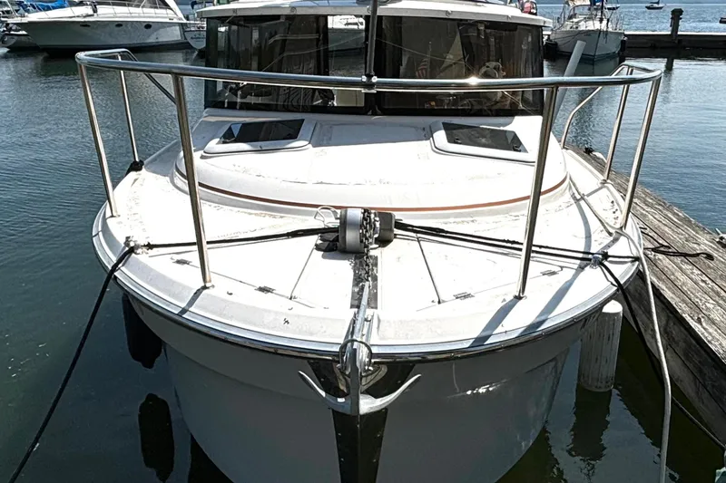 Slide: The Image of 2021 Ranger Tugs R-25 boat docked at marina, front view. - 4