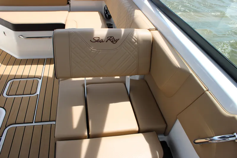 Slide: The Image of Interior of a Sea Ray SDX 250 Surf with beige upholstery and quilted design. - 28