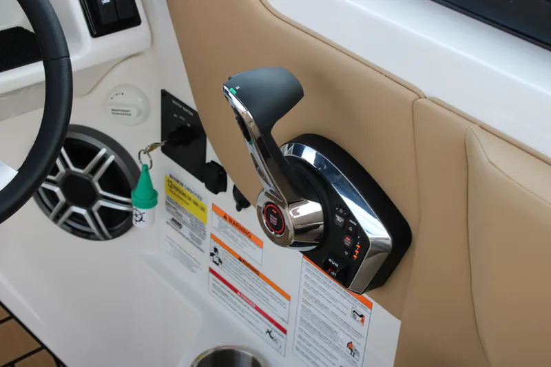 Slide: The Image of Close-up of the throttle and controls on a Sea Ray SDX 250 Surf boat. - 31