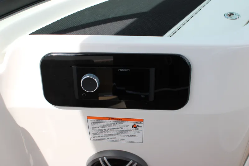 Slide: The Image of The image shows a Fusion audio system on a Sea Ray SDX 250 Surf boat. - 24