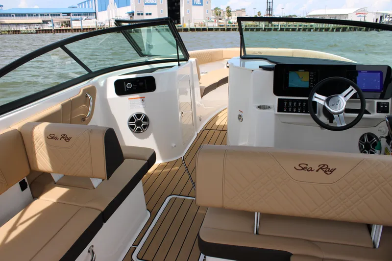 Slide: The Image of The image shows the interior of a 2026 Sea Ray SDX 250 Surf boat with sleek seating and modern features. - 11