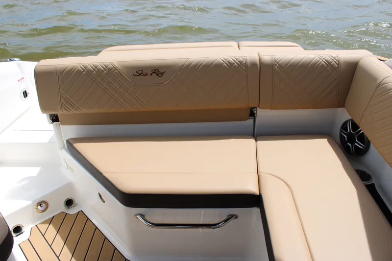 Slide: The Image of The 2026 Sea Ray SDX 250 Surf features elegant beige upholstery and a modern design. - 33