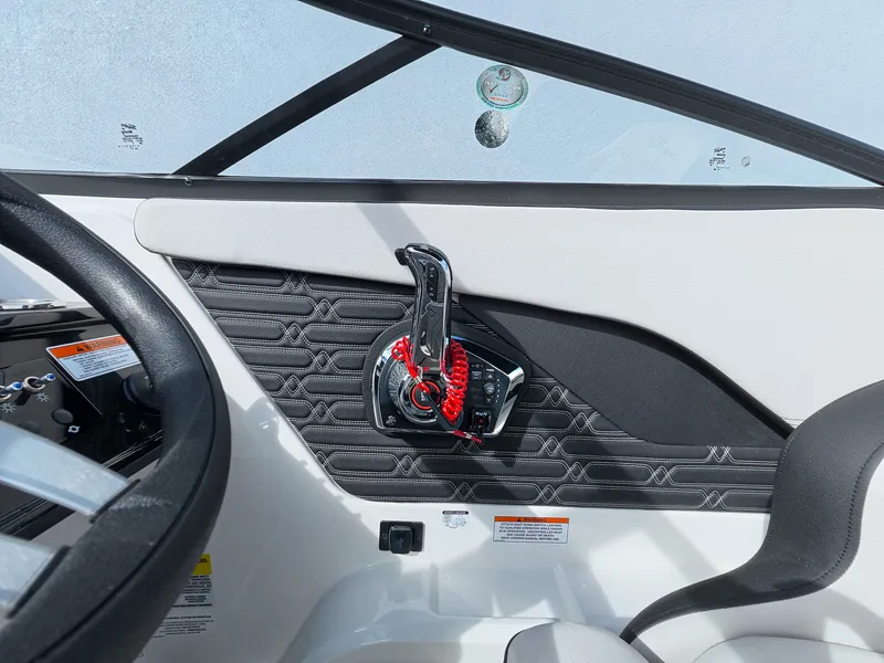 Slide: The Image of Close-up of a Sea Ray SPX 210 Outboard helm with modern controls. - 27