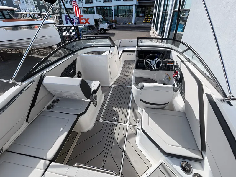 Slide: The Image of Interior view of a 2027 Sea Ray SPX 210 Outboard with modern seating and helm console. - 13