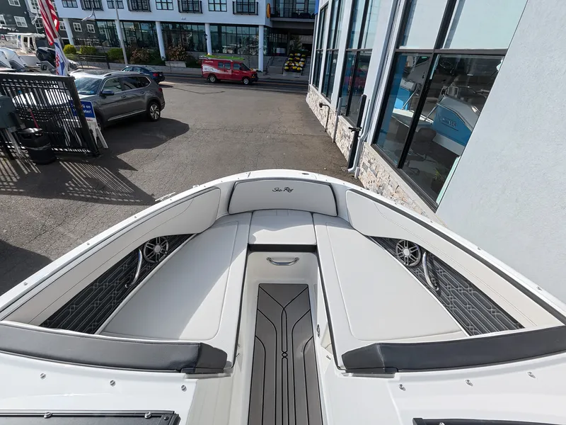 Slide: The Image of The image shows the bow of a Sea Ray SPX 210 Outboard with gray upholstery. - 32