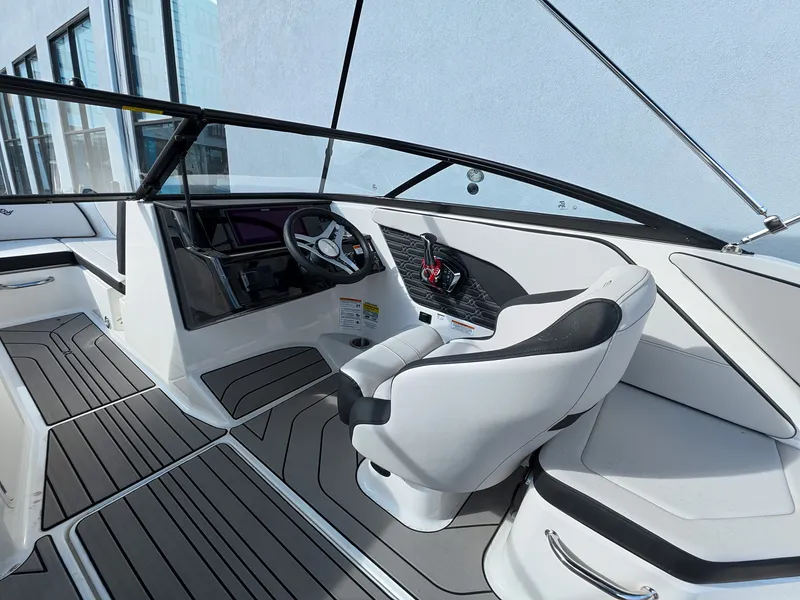 Slide: The Image of Interior of a Sea Ray SPX 210 Outboard with a modern helm and comfortable seating. - 22