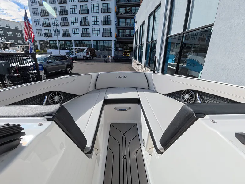 Slide: The Image of The image shows the bow of a Sea Ray SPX 210 Outboard boat with sleek seating. - 31