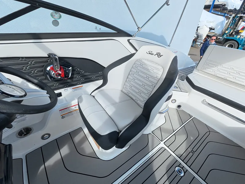 Slide: The Image of Interior view of a Sea Ray SPX 210 Outboard with stylish seating and modern helm area. - 23