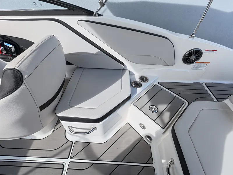 Slide: The Image of Interior of a Sea Ray SPX 210 Outboard with gray upholstery and modern details. - 20
