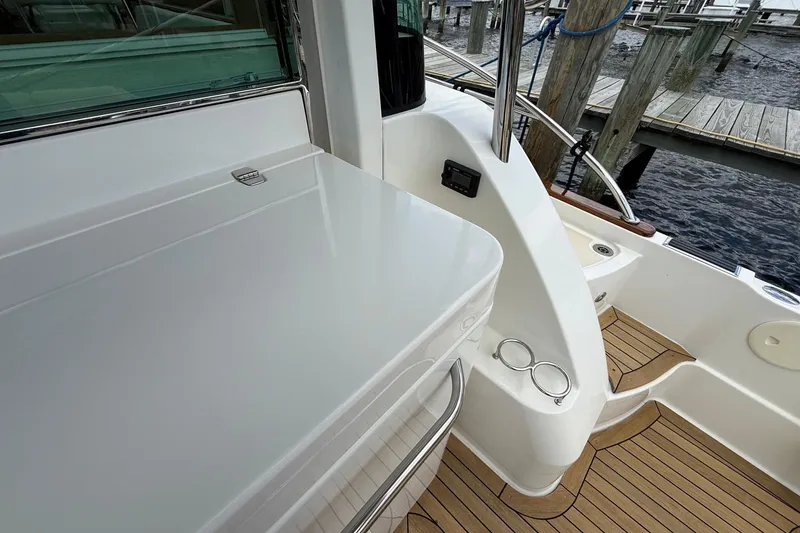 Slide: The Image of 2019 Sabre 45 Salon Express yacht deck with sleek design and wooden flooring. - 10