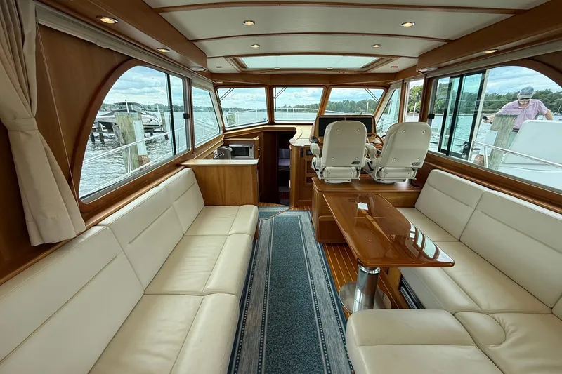 Slide: The Image of Luxurious interior of 2019 Sabre 45 Salon Express yacht with elegant seating and panoramic windows. - 12