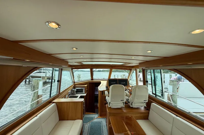 Slide: The Image of Interior of 2019 Sabre 45 Salon Express yacht with elegant wood finish and seating. - 13