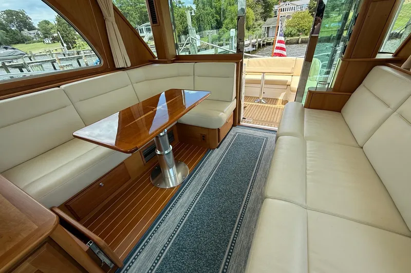 Slide: The Image of Luxurious interior of 2019 Sabre 45 Salon Express yacht with elegant seating and wooden table. - 14