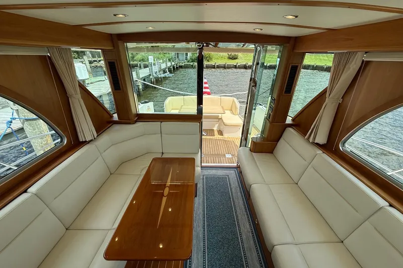 Slide: The Image of Interior of 2019 Sabre 45 Salon Express yacht with elegant seating and wooden accents. - 15
