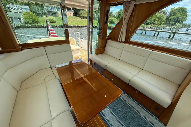 Slide: The Image of Luxurious interior of 2019 Sabre 45 Salon Express yacht with elegant seating and wooden table. - 17